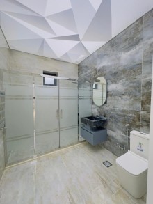 A one-story 4-room new villa is for sale in Baku on the Shüvelan Seaside Road, -18