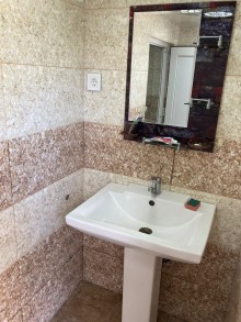 A single-story cottage is for sale in Şüvəlan, -16
